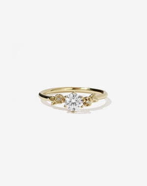 Meadowlark Jewellery’s iconic Alba Engagement Ring in 9ct Yellow Gold, claw set with a 0.50ct round brilliant cut white diamond. Round band adorned with flowers, set with round brilliant cut white diamonds. Pair with our bestseller, the Alba Band Stone Set or Plain. Made in New Zealand.