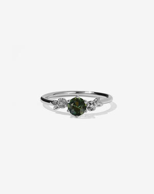 Meadowlark Jewellery’s iconic Alba Engagement Ring in Platinum, claw set with a round brilliant cut green sapphire. Round band adorned with flowers, set with round brilliant cut white diamonds. Pair with our bestseller, the Alba Band Stone Set or Plain. Made in New Zealand.