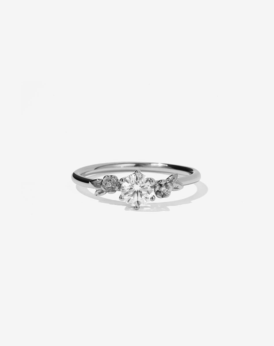 Meadowlark Jewellery’s iconic Alba Engagement Ring in Platinum, claw set with a 0.50ct round brilliant cut white diamond. Round band adorned with flowers, set with round brilliant cut white diamonds. Pair with our bestseller, the Alba Band Stone Set or Plain. Made in New Zealand.