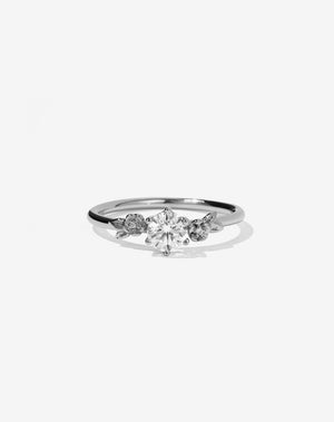 Meadowlark Jewellery’s iconic Alba Engagement Ring in Platinum, claw set with a 0.50ct round brilliant cut white diamond. Round band adorned with flowers, set with round brilliant cut white diamonds. Pair with our bestseller, the Alba Band Stone Set or Plain. Made in New Zealand.