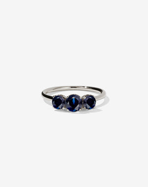 A classic three stone engagement ring in white gold with blue sapphires.