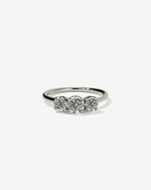 A classic three stone engagement ring in white gold with grey diamonds.