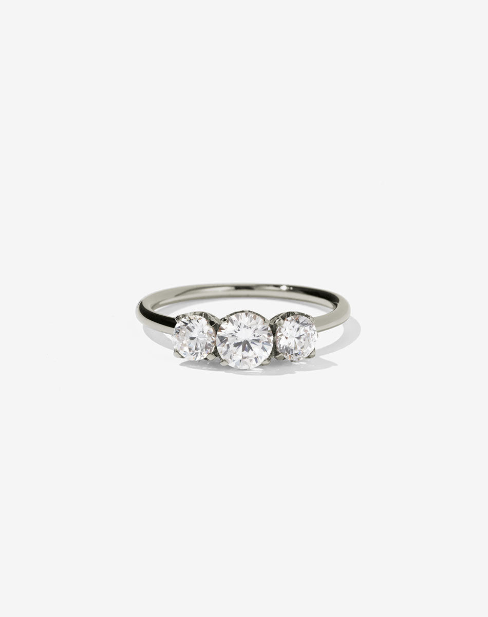 A classic three stone engagement ring in white gold with diamonds.