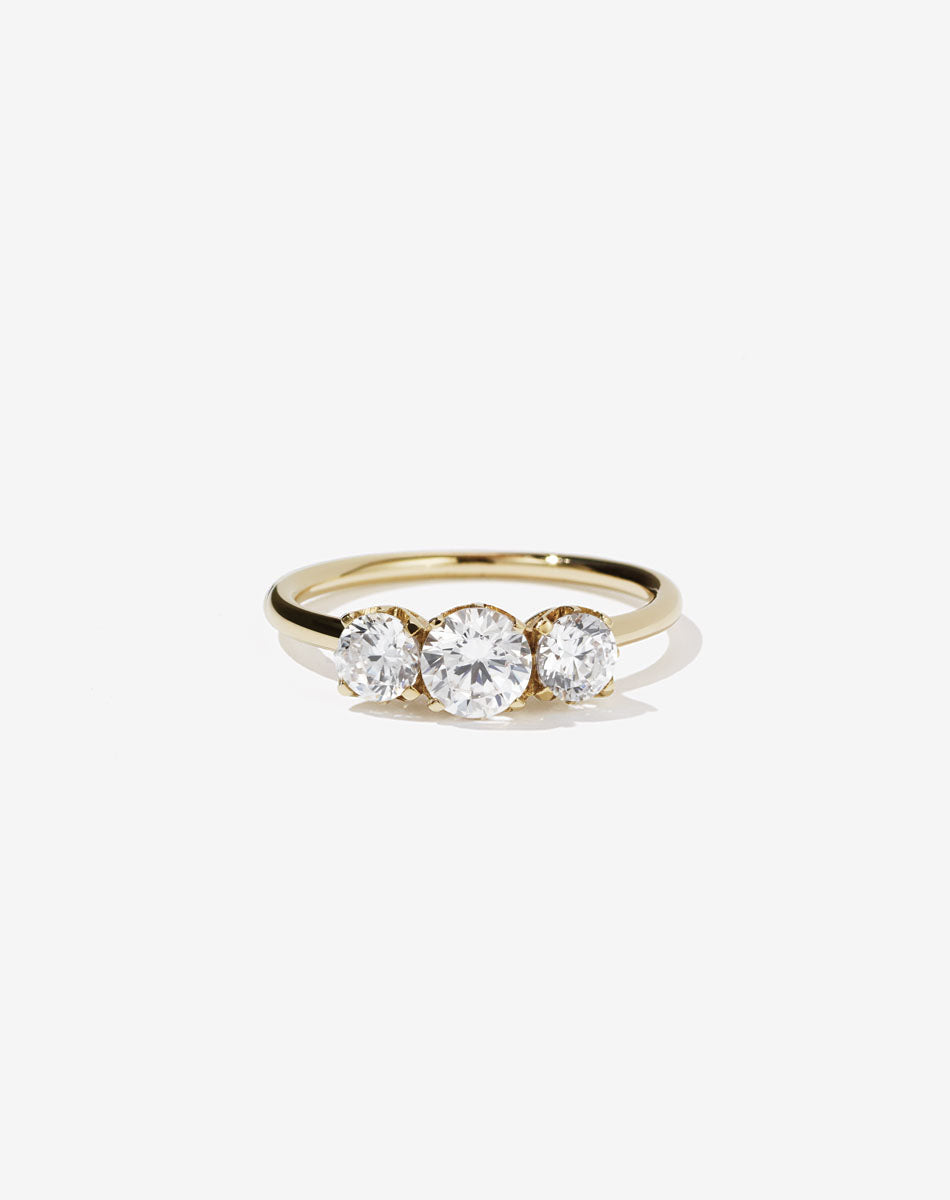 Meadowlark Jewellery’s classic Signature 3 Stone Engagement Ring in 14ct Yellow Gold, with 1ct round brilliant cut white diamonds. Set into our signature Meadowlark claw setting, featuring graphic lines inspired by our insignia. Pair with our bestseller, the Amelie Band Pave or Plain. One of our most timeless and beloved Ceremonial designs, made to order in New Zealand.