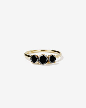 Meadowlark Jewellery’s classic Signature 3 Stone Engagement Ring in 14ct Yellow Gold, with 1ct round brilliant cut black diamonds. Set into our signature Meadowlark claw setting, featuring graphic lines inspired by our insignia. Pair with our bestseller, the Amelie Band Pave or Plain. One of our most timeless and beloved Ceremonial designs, made to order in New Zealand.