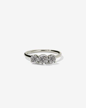 A classic three stone engagement ring in white gold with grey diamonds.