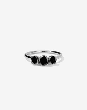 A classic three stone engagement ring in platinum with black diamonds.