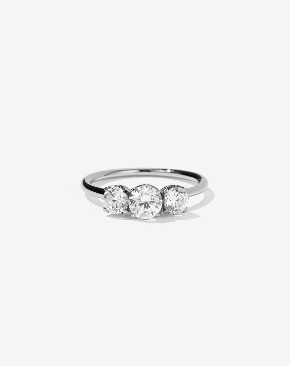 A classic three stone engagement ring in platinum with diamonds.