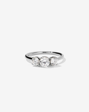 A classic three stone engagement ring in platinum with diamonds.