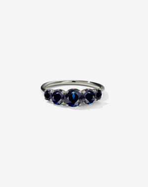 A classic white gold, five stone diamond engagement ring. Set with blue sapphires.