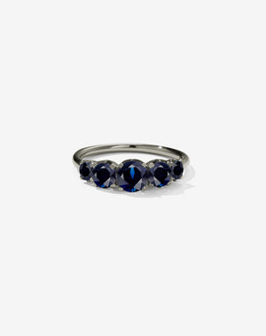 A classic white gold, five stone diamond engagement ring. Set with blue sapphires.