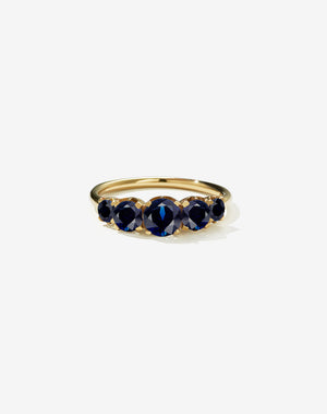 A classic yellow gold, five stone diamond engagement ring. Set with blue sapphires.