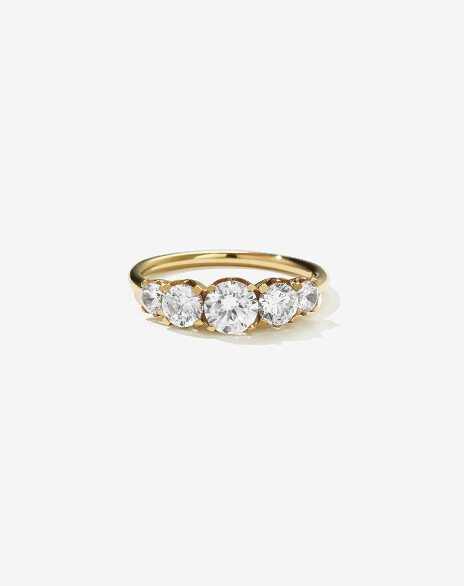 A classic yellow gold, five stone diamond engagement ring. Set with diamonds.