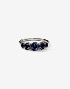 A classic white gold, five stone diamond engagement ring. Set with blue sapphires.