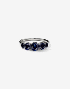 A classic white gold, five stone diamond engagement ring. Set with blue sapphires.