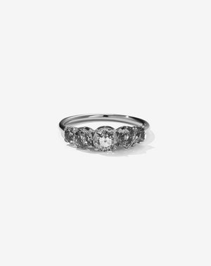 A classic white gold, five stone diamond engagement ring. Set with grey diamonds.