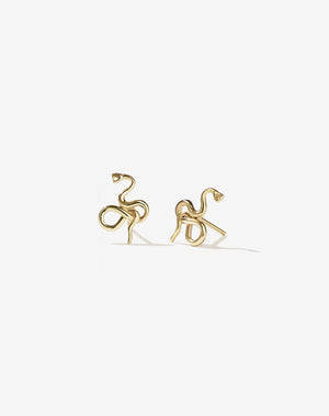 A pair of gold-plated stud earrings in a design that resembles a serpentine or a snake.